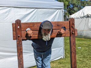 ren faire pillory stock evil corporations