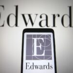 Edwards Lifesciences logo on phone and wall