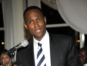 an image of the CEO scammer who goes by the first name of Eddy. He is wearing a cheap suit!